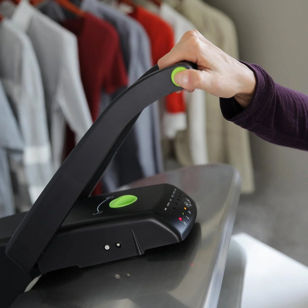 Digital steam press, featuring multiple fabric setting functions and steam impact function, made of stainless steel / black.